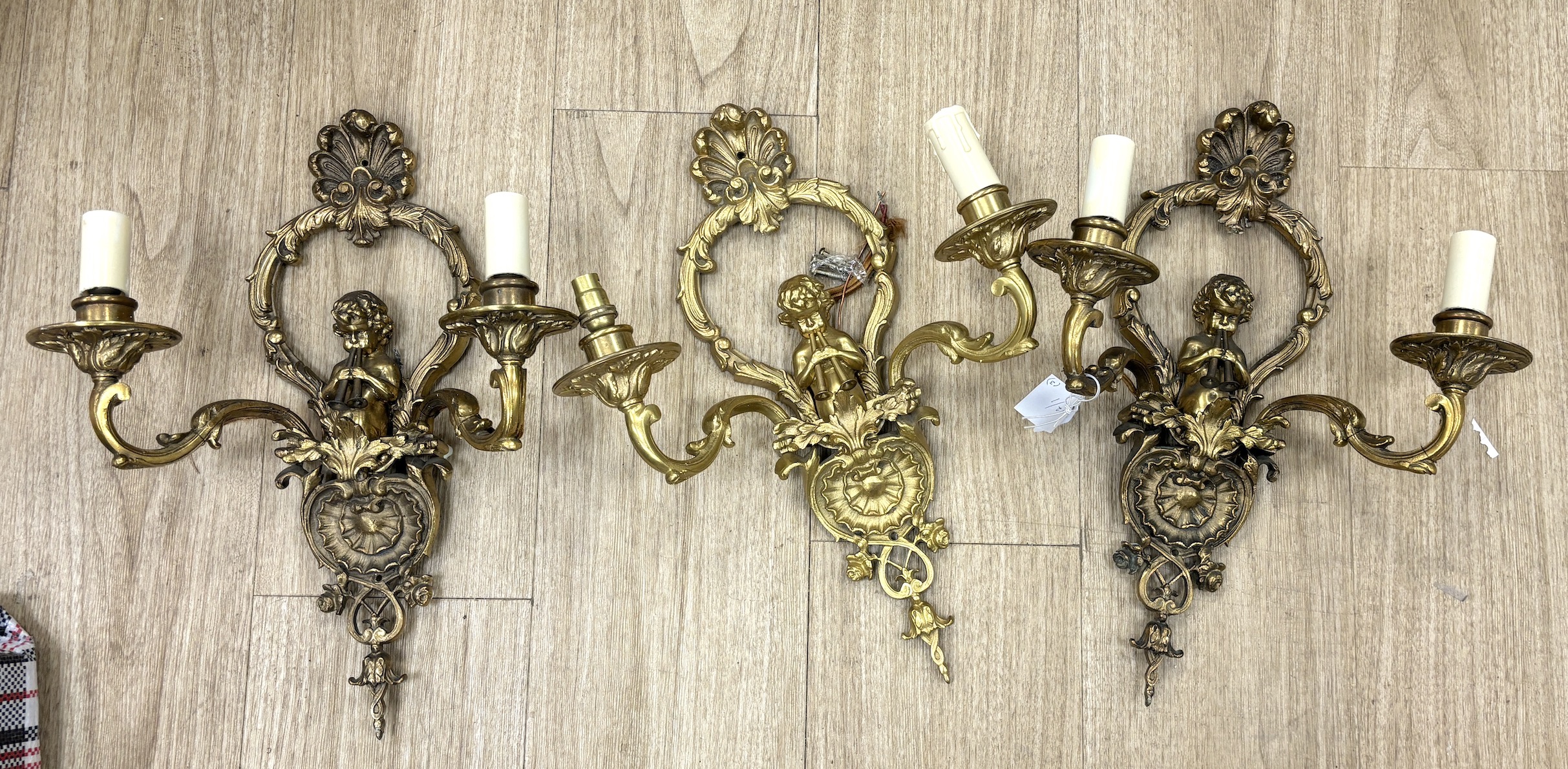 A set of three ormolu wall lights